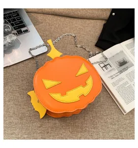 Halloween pumpkin shoulder bag, cute orange PU leather crossbody bag with chain strap for women.