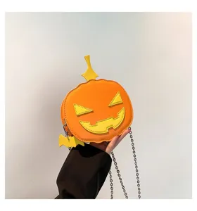 Pumpkin crossbody bag detail showing orange PU leather with cute yellow face and chain.