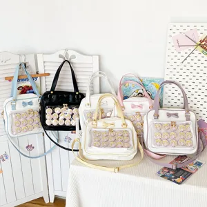 Cute bow Ita bag with transparent front pocket for anime pin badges and JK uniform.