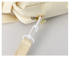Close-up detail of the yellow mini ita bag strap and zipper, cute daily accessory.