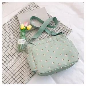 Casual vintage green floral canvas messenger bag with adjustable strap and large capacity.