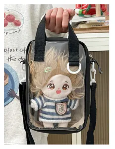 Detailed view of the clear ita bag featuring a cute 20cm plush doll wearing striped knitwear.