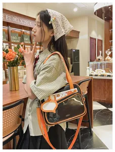 Borsa ita in stile giapponese con finestra trasparente, borsa a tracolla nera e arancione.