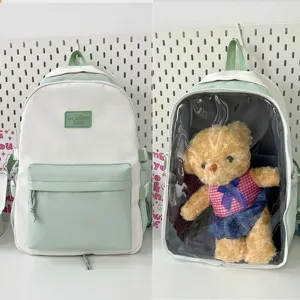 Detailed shot of Japanese transparent ita backpack with plush doll window design.