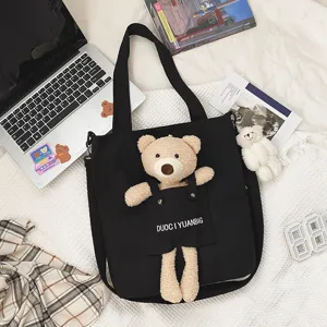 Lindo bolso tote de lona negra con peluche de oso 3D, bolso cruzado de estilo japonés.