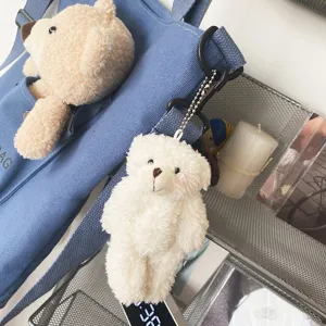 Bolso cruzado de lona azul con lindo osito de peluche y colgante de oso suave.