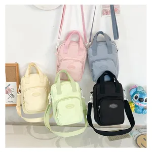 Cute Japanese ins style canvas crossbody bag for 20cm cotton dolls and daily casual wear.