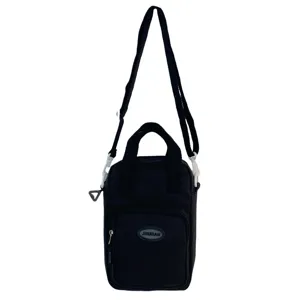 Black canvas crossbody bag detail shot, front zipper pocket design, compact daily carry.
