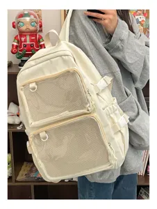 Japanese style canvas ita backpack with double mesh front pockets for anime badges and daily use.