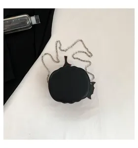 Close-up detail view of the black pumpkin shaped shoulder bag with silver chain strap.