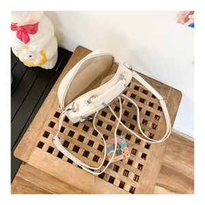 Cute white PU mini backpack and crossbody bag detail view, casual everyday style for women.