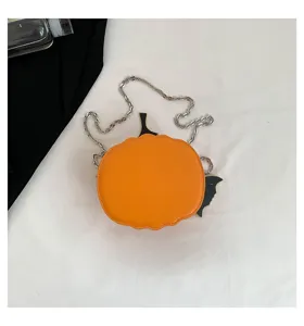 Halloween pumpkin crossbody bag detail, orange leather purse with chain strap and bat decor.