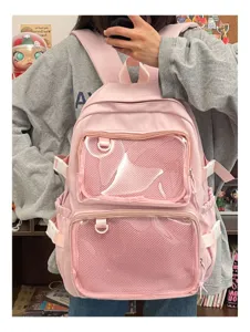 Pink cute ita backpack with clear mesh pockets for pins and badges. Detail view of student bag.