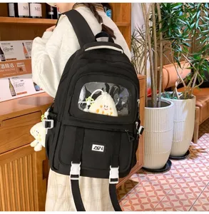 Black canvas school backpack with clear window, large capacity pain bag for students.
