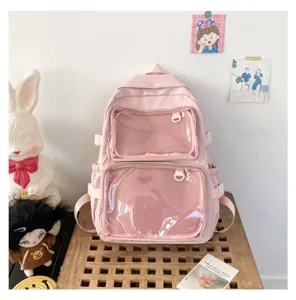 Pink transparent mesh pocket ita bag detail showing front dual display compartments and style.