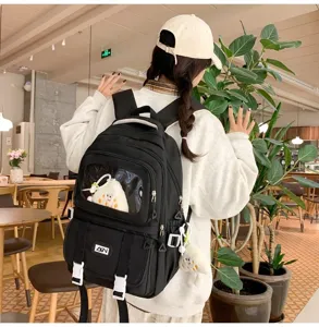 Detailed shot of a black canvas ita bag with clear pocket, backpack style, campus vibe.