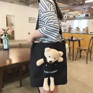 Lindo bolso bandolera de lona para mujer con adorable oso de peluche, estilo casual.