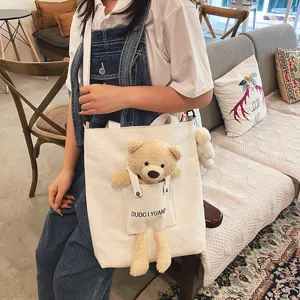 Bolsa de lona bonita con muñeco de peluche de oso para mujeres estudiantes bolso