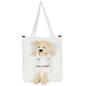 Bonito bolso de lona blanca con colgante de peluche de oso 3D, bolso de hombro informal de moda.