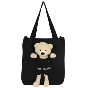 Bolso tote de lona negro con detalle de bolsillo de oso de peluche lindo informal.