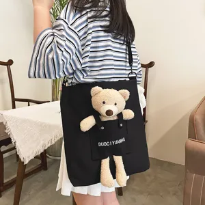 Bonito bolso de lona estilo japonés para mujer con lindo oso de peluche y bolsillo frontal.