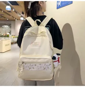 Trendy canvas backpack for women, floral patchwork school bag with cute dog pendant daily.