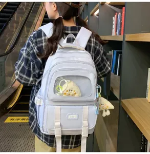 Cute light blue student backpack with clear window pocket, casual canvas school bookbag for girls.