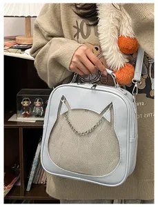 Close-up details of the cute cat ear ita bag with mesh window, chain, and crossbody strap.