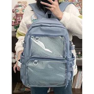 Light blue ita backpack with clear window pockets for pins, casual school book bag for girls.