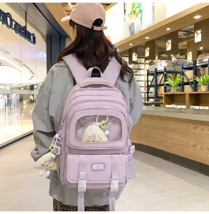 Casual purple canvas backpack for school students with transparent window and cute doll design.