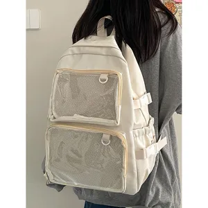 Casual white ita backpack with transparent double front pockets for anime pins and badges.