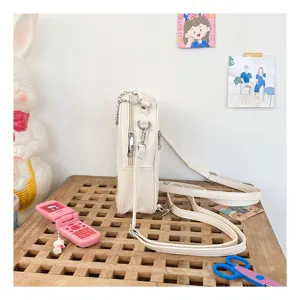 Detail view of a white PU mini backpack, versatile Japanese style casual crossbody bag for women.