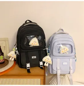 Cute transparent window canvas school backpack with plush charm, perfect for daily student use.