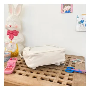 Detailed view of white PU mini ita bag, transparent window design, cute casual daily details.