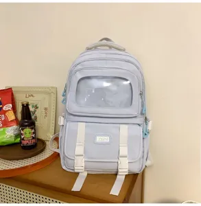 Light blue canvas student backpack with clear window, large capacity school book bag.