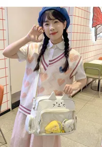 Cute cat ear ita bag detail showing transparent pocket with plush toys and JK style outfit.