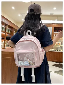 Cute pink mini ita bag backpack with clear transparent window for pins badges and anime dolls.