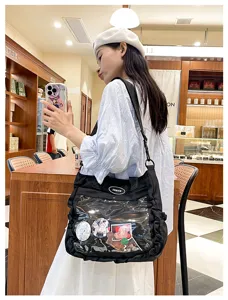 Black canvas ita bag with transparent front pocket for anime badges, casual crossbody bag for women.