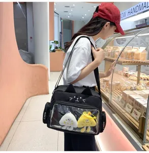 Black cat ita bag with transparent window and cute plush charms, stylish daily crossbody bag.
