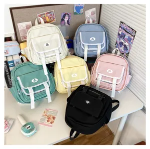 Detailed view of colorful Japanese style JK uniform mini backpacks displayed together.