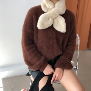 Cozy faux fur crisscross scarf for women, soft plush winter neckerchief, stylish daily wear detail shot.