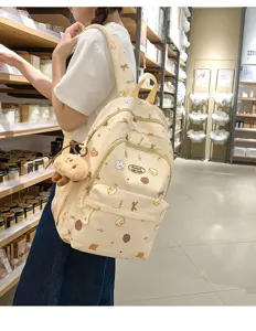 Süßer beiger Canvas Rucksack für Mädchen, lässige Schultasche mit niedlichem Plüschbären.