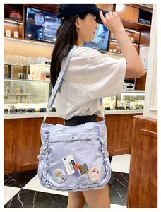 Sweet purple ita bag with transparent window, perfect for anime pins, stylish casual crossbody.