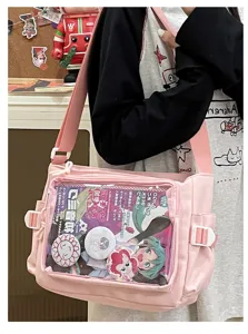 Japanese pink canvas ita bag with transparent window for anime pins and badges display.