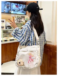Japanese anime transparent ita bag, white canvas crossbody bag with cute charms.