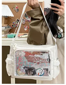 Japanese style canvas ita bag with transparent pocket for anime badges, cute white crossbody bag.