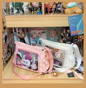 Canvas ita bag detail showing transparent window, pink and white colors for anime pins.