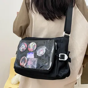 Japanese style transparent ita canvas shoulder bag detail view with anime badge display.