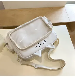 White cat ear ita bag with clear window and adjustable crossbody strap for daily use.