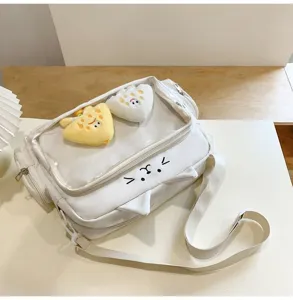 White cat ita bag with transparent window, cute plush pendants, kawaii student crossbody bag.